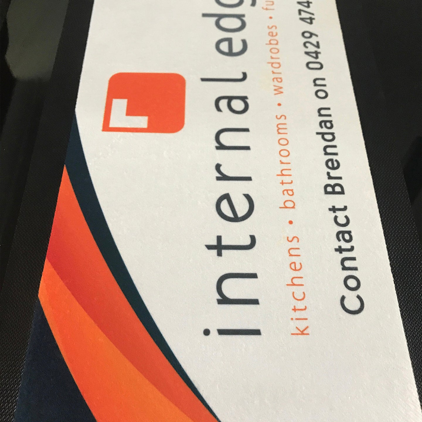 Promotional leaflet for 'Internal Edge' with contact information on a black background