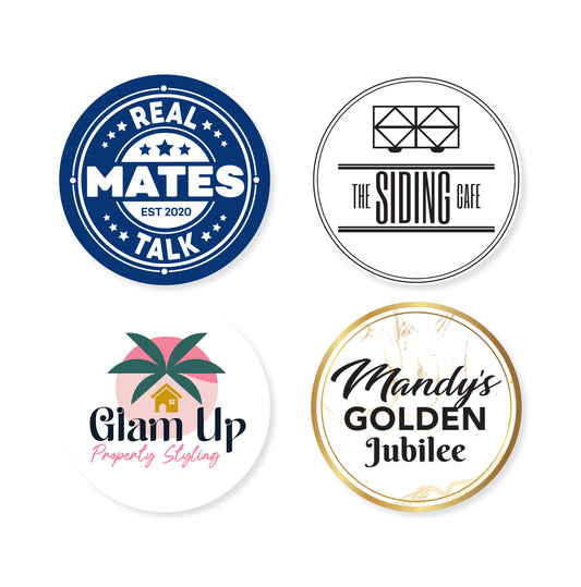 Four different circle stickers on a white background in various sizes